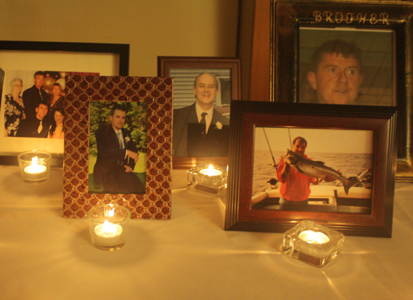 Photos of family members on candlelit table