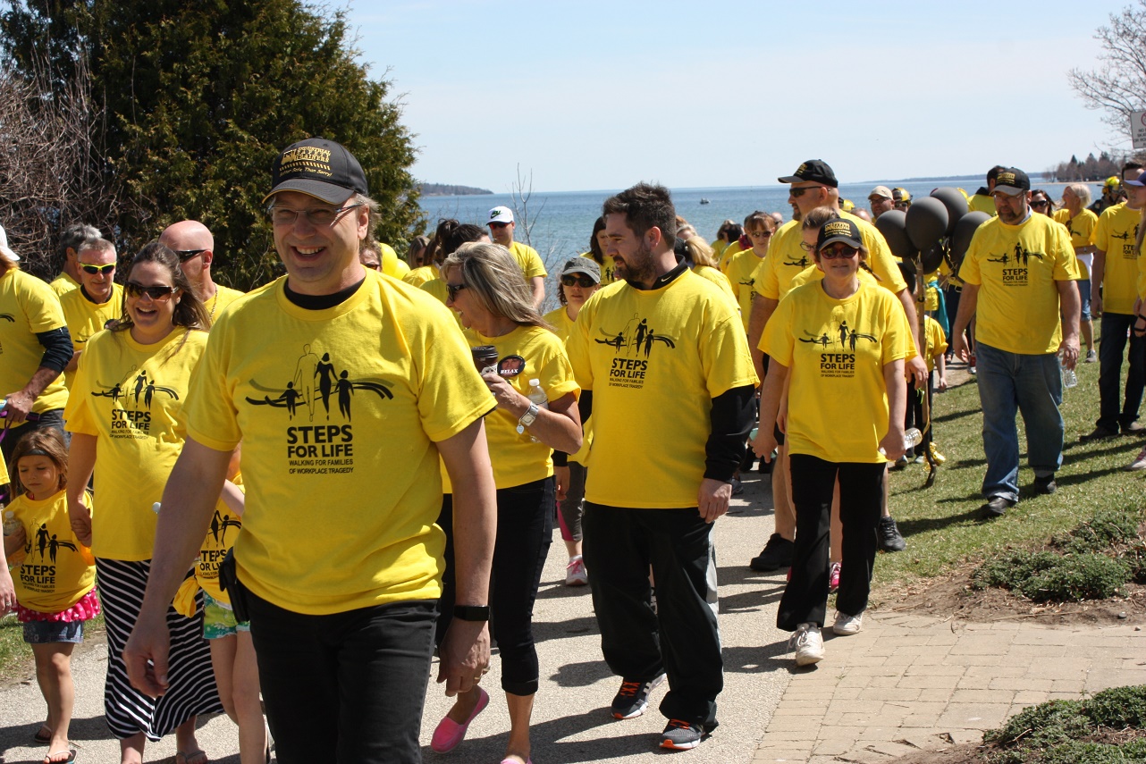 Walkers in yellow T-shirts