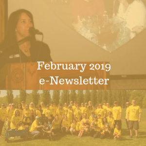 February 2019 e-Newsletter text overlays a photo of a woman speaking at a podium and a group of people in yellow t-shirts