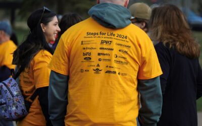 Leading from the back (of a Steps for Life T-shirt)